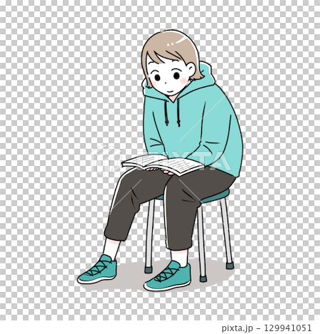 一個女人坐在椅子上看書 一個女人坐在椅子上看書 129941051