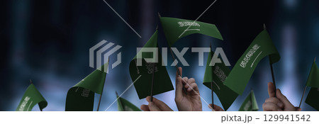 USA flags in their hands on a blurred urban background 129941542