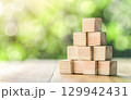 Ladder career path for business growth success process concept. Wooden blocks are stacked in steps that continue to rise. 129942431