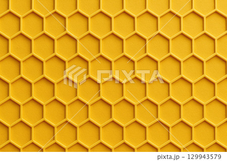 Seamless yellow honeycomb pattern with hexagonal structure creates vibrant geometric texture reminiscent of beehive design 129943579