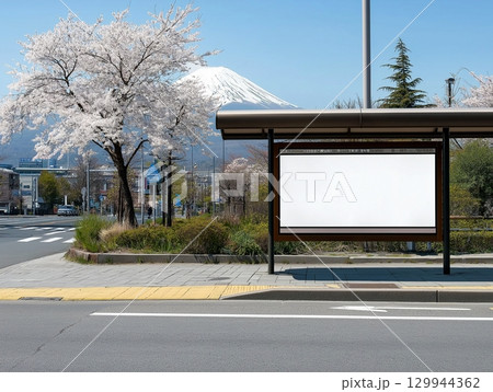 The blank billboard at the Japan bus stop station with Fuji mountain and Sakura on the background 129944362