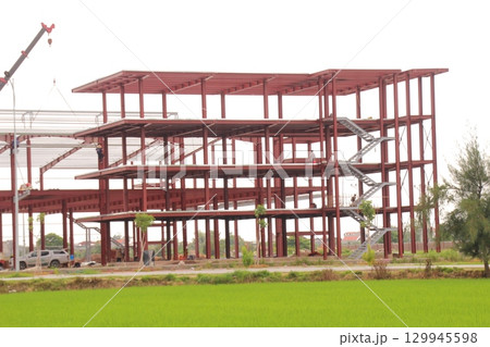 on construction site in vietnam. Construction workers. Machinery is digging the ground 129945598