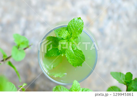 Mojito or cocktail ,mocktail or lime juice or lemon juice, lemon soda or tonic or soda and peppermint leaf Mojito or cocktail ,mocktail or lime juice or lemon juice, lemon soda or tonic or soda and peppermint leaf 129945861