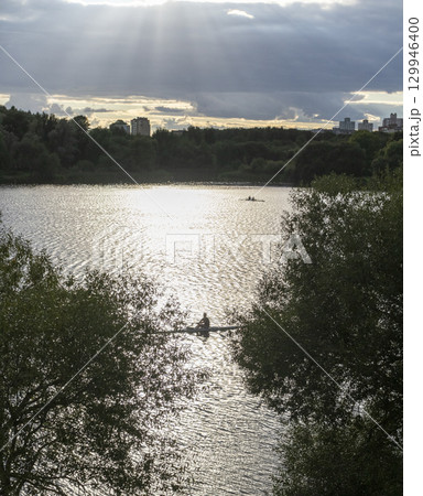 People practicing rowing on the lake. Sports 129946400