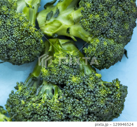 Shot of the broccoli on the blue background 129946524