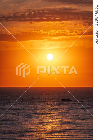 Beautiful red and orange sunrise over the sea. 129946951