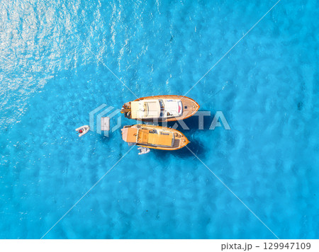 Vacation and leisure. Aerial view on fast boats on blue Mediterranean sea at sunny day. Vacation and leisure. Aerial view on fast boats on blue Mediterranean sea at sunny day. 129947109