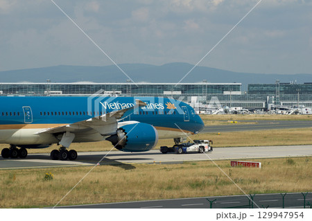 Frankfurt, Germany, July 9, 2017: Close-Up of Vietnam Airlines Boeing 787 on Taxiway Tow Frankfurt, Germany, July 9, 2017: Close-Up of Vietnam Airlines Boeing 787 on Taxiway Tow 129947954