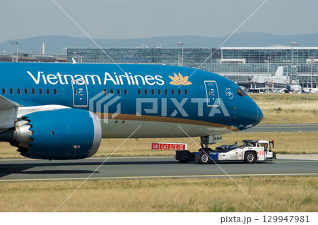 Frankfurt, Germany, July 9, 2017: Close-Up of Vietnam Airlines Boeing 787 on Taxiway Tow Frankfurt, Germany, July 9, 2017: Close-Up of Vietnam Airlines Boeing 787 on Taxiway Tow 129947981