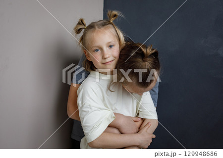 Smiling children little girl and boy together at home. Sibling indoor, childhood concept Smiling children little girl and boy together at home. Sibling indoor, childhood concept 129948686