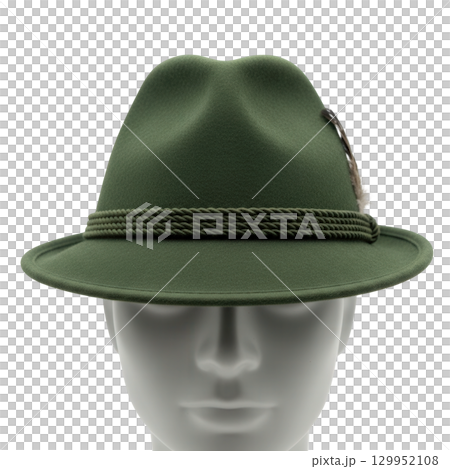 Green traditional tyrolean hunting hat with a feather on a grey mannequin head for fashion 129952108
