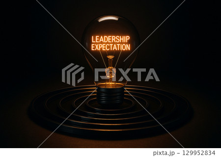 A glowing golden sphere within concentric circles displaying leadership expectation as a guiding central concept A glowing golden sphere within concentric circles displaying leadership expectation as a guiding central concept 129952834