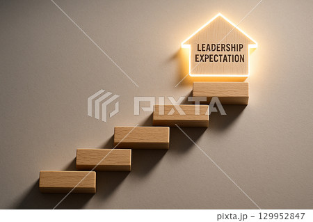 Straight view of wooden steps ascending with the words leadership expectation. Leadership concept. 129952847