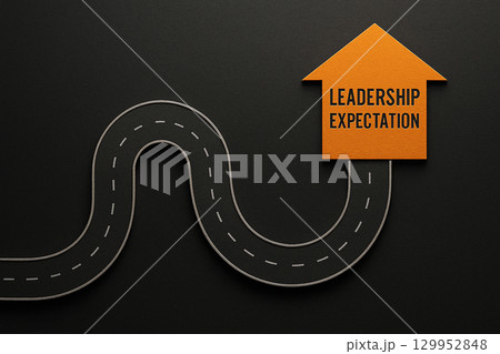 A winding road with a glowing orange arrow labeled leadership expectation symbolizing a journey of guidance and vision 129952848