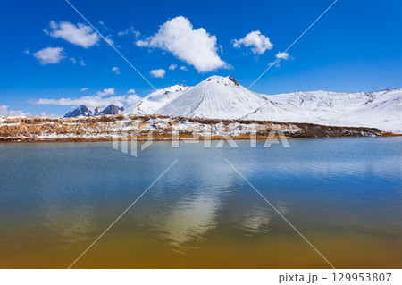 Shorkul lake and Pamir mountains near Murghab town, Tajikistan 129953807