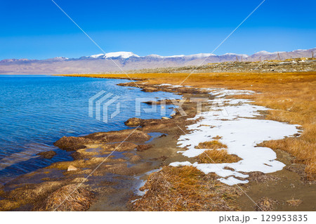 Karakul lake in the Pamir Mountains in Tajikistan Karakul lake in the Pamir Mountains in Tajikistan 129953835