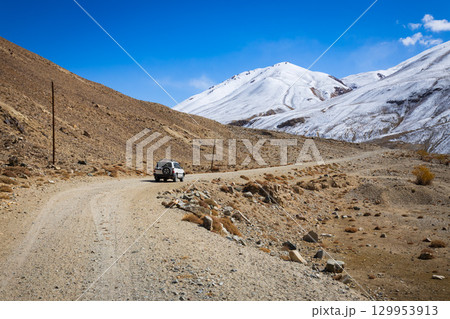 Off-road vehicle at the Pamir highway in Tajikistan Off-road vehicle at the Pamir highway in Tajikistan 129953913