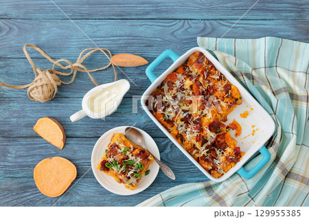 sweet potato casserole with bacon, cheese, onion 129955385