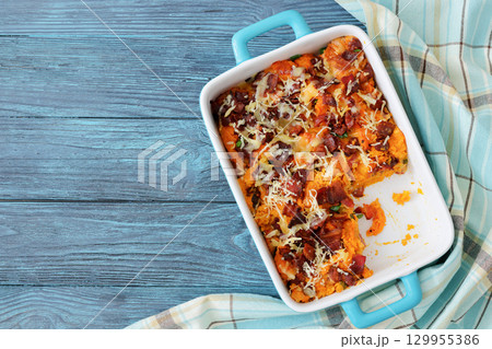 sweet potato casserole with bacon, cheese, onion 129955386