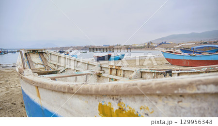 A boat on it is sitting on the beach A boat on it is sitting on the beach 129956348