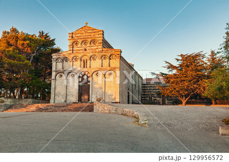 Basilica of San Pietro di Sorres in Sardinia, Italy, illuminated by golden sunset light Basilica of San Pietro di Sorres in Sardinia, Italy, illuminated by golden sunset light 129956572