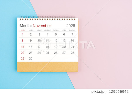November 2026 desk calendar on blue and pink color background, with copy  space. 129956942