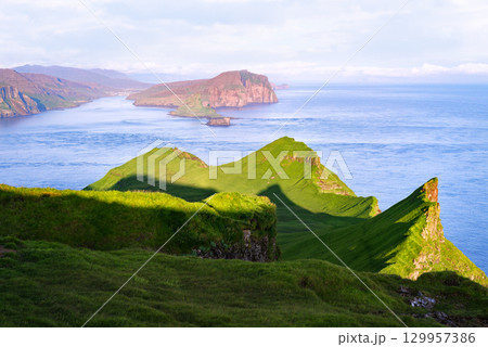 Scenic View of Tindholmur and Vagar from Mykines in Summer, Faroe Islands Scenic View of Tindholmur and Vagar from Mykines in Summer, Faroe Islands 129957386