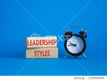 Leadership Styles symbol. Concept word Leadership Styles on wooden blocks. Beautiful blue background with alarm clock. Business and Leadership Styles concept. Copy space Leadership Styles symbol. Concept word Leadership Styles on wooden blocks. Beautiful blue background with alarm clock. Business and Leadership Styles concept. Copy space 129958694