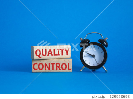 Quality Control symbol. Wooden blocks with words Quality Control. Beautiful blue background with alarm clock. Business and Quality Control concept. Copy space. Quality Control symbol. Wooden blocks with words Quality Control. Beautiful blue background with alarm clock. Business and Quality Control concept. Copy space. 129958698