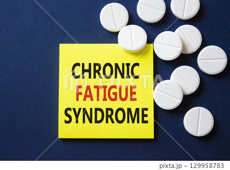 Chronic Fatigue Syndrome symbol. Concept word Chronic Fatigue Syndrome on yellow note. Beautiful deep blue background with pills. Medicine and Chronic Fatigue Syndrome concept. Copy space Chronic Fatigue Syndrome symbol. Concept word Chronic Fatigue Syndrome on yellow note. Beautiful deep blue background with pills. Medicine and Chronic Fatigue Syndrome concept. Copy space 129958783