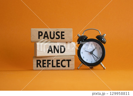 Pause and Reflect symbol. Concept words Pause and Reflect on wooden blocks. Beautiful orange background with alarm clock. Business and Pause and Reflect concept. Copy space. Pause and Reflect symbol. Concept words Pause and Reflect on wooden blocks. Beautiful orange background with alarm clock. Business and Pause and Reflect concept. Copy space. 129958811