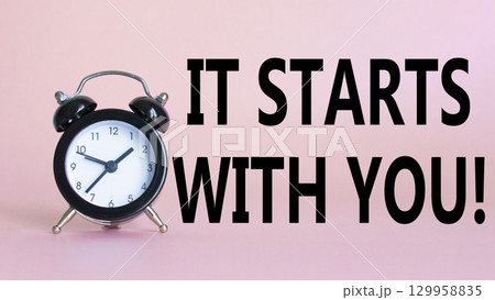 It starts with you symbol. Beautiful pink background with alarm clock. Business and It starts with you concept. Copy space. It starts with you symbol. Beautiful pink background with alarm clock. Business and It starts with you concept. Copy space. 129958835