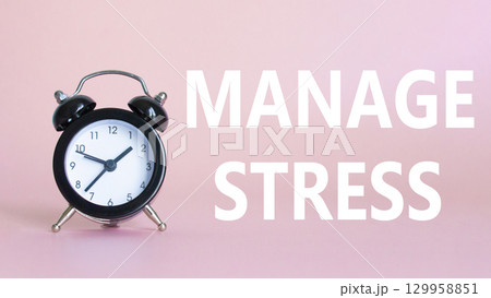 Manage stress symbol. Concept word Manage stress on Beautiful pink background with alarm clock. Medicine and Manage stress concept. Copy space Manage stress symbol. Concept word Manage stress on Beautiful pink background with alarm clock. Medicine and Manage stress concept. Copy space 129958851
