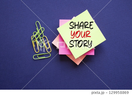 Share your story symbol. Sticky notes with words Share your story. Beautiful deep blue background. Business and Share your story concept. Copy space. Share your story symbol. Sticky notes with words Share your story. Beautiful deep blue background. Business and Share your story concept. Copy space. 129958869