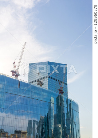 skyscraper under construction in the blue sky background 129960579