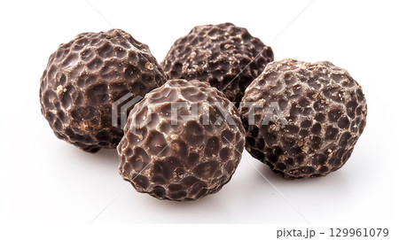 Delicious chocolate truffles on a white surface. 129961079