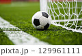 Soccer ball by the goal line 129961111