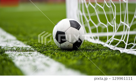 Soccer ball by the goal line Soccer ball by the goal line 129961111