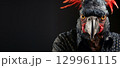 Exotic bird with a vivid plumage as a human-like person. 129961115