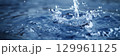 Water splash in serene blue tones 129961125