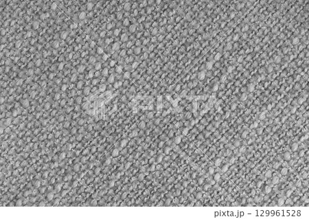 Textured gray fabric close up, macro. Soft woven textile surface in diagonal pattern, background Textured gray fabric close up, macro. Soft woven textile surface in diagonal pattern, background 129961528