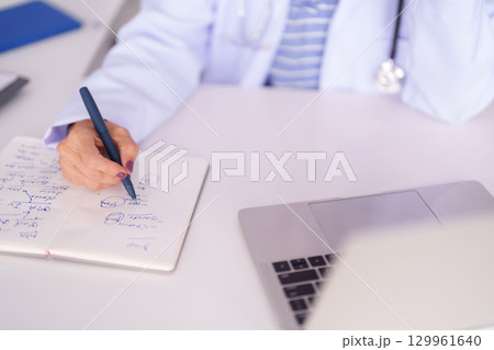 Medical Professional Records Patient Information Healthcare Setting Office Desk Stethoscope Laptop Medical Professional Records Patient Information Healthcare Setting Office Desk Stethoscope Laptop 129961640