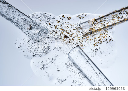 Three test tubes with spilled serums. Demonstration of textures. Three test tubes with spilled serums. Demonstration of textures. 129963038