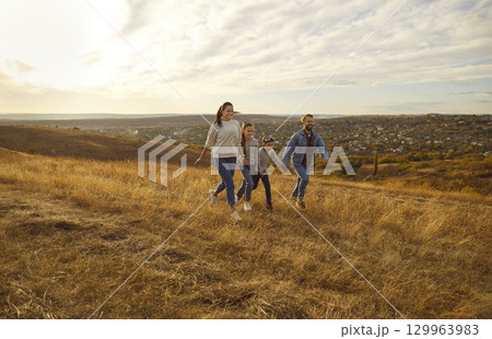 Happy Family Enjoying Nature During Vacation 129963983
