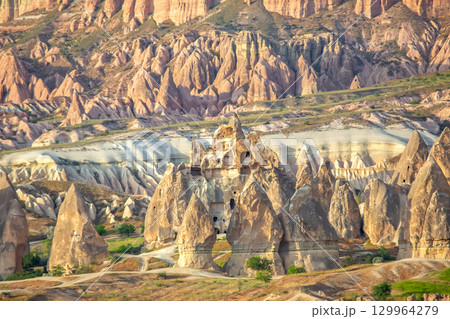Unique rock formations and fairy chimneys in Cappadocia, Turkey during golden hour 129964279