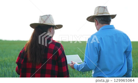 Digital farming partnership, Problem solving on the farm, Agri-business innovation, Field experts at work, Modern equipment on the field, Cutting-edge farming, Successful rural business, New 129965064