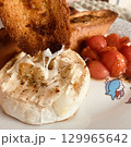 Enjoy Gourmet Baked Camembert with Grilled Tomatoes and Toast, perfect for any celebration 129965642