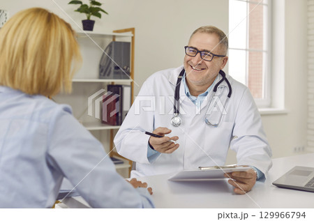 Female patient visiting a friendly doctor at the office during medical examination. 129966794