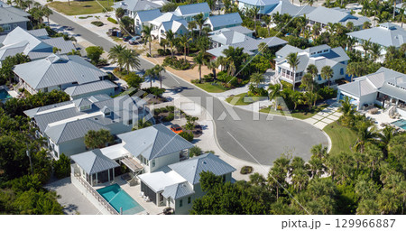 Low-density private homes. Rural street cul-de-sac dead end in residential suburbs with upscale suburban houses outside of Sarasota, Florida 129966887