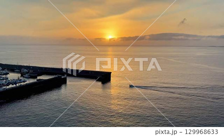 Enjoy a picturesque sunset over the harbor, combined with a delightful boat journey 129968633